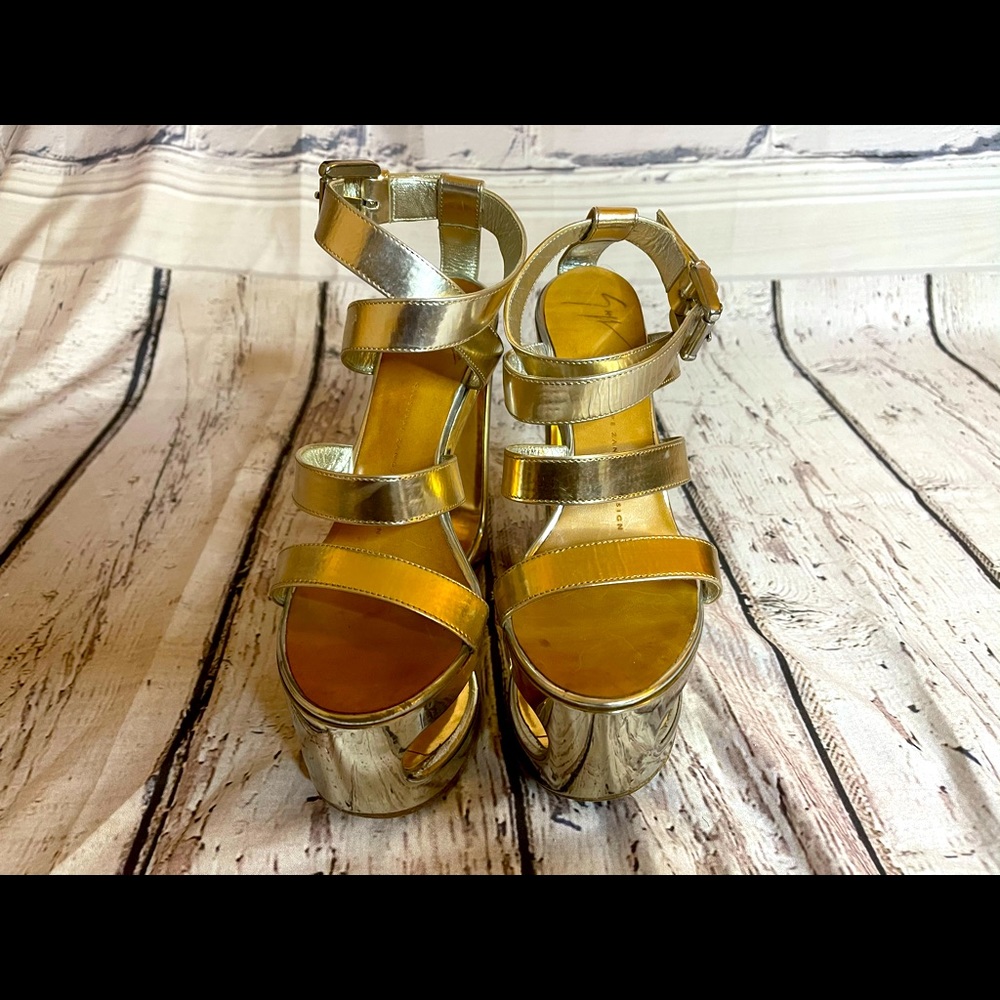Metallic gold platform wedge sandals.